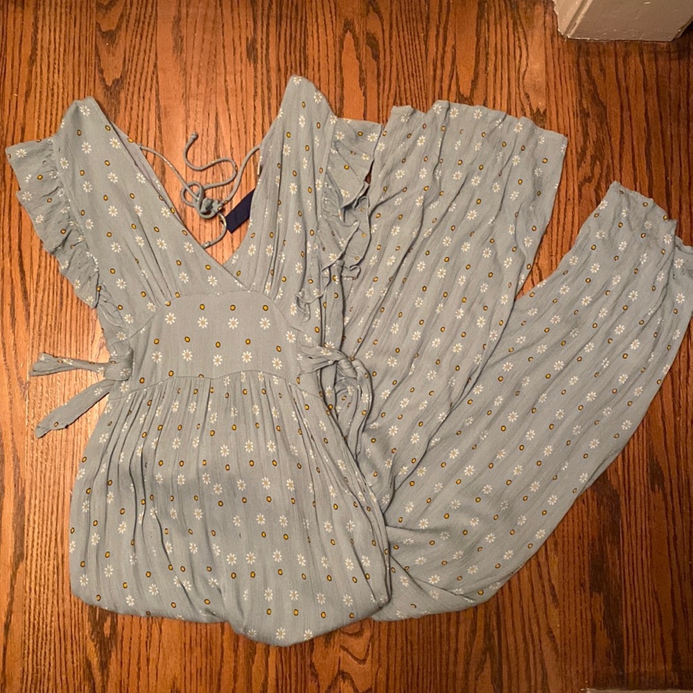 light blue jumpsuit with small yellow and white detail